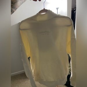 Brand new never worn Fear Of God Essentials “Cloud Dancer” hoodie size is Mens M